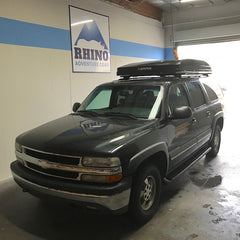 Chevy Suburban with Rhino Rack Vortex bars and iKamper installed at Rhino Adventure Gear Showroom