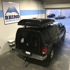 black 2017 Ram 2500 truck with black iKamper Skycamp Roof Top Tent installed at Rhino Adventure Gear Showroom, in Richmond CA