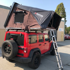 red Jeep JKU with iKamper roof top tent and Rhino Rack Backbone Vortex Quick Release Rack System