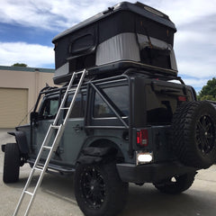 Jeep JKU with Smittybilt Exoskeleton Rack System and James Baroud Evasion Standard Roof Top Tent