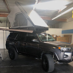 5th Gen Toyota 4Runner with Camp King RTT Aluminum Roof Top Tent and Batwing Awning on Rhino Rack Backbone Pioneer Platform Rack System installed at Rhino Adventure Gear San Diego CA