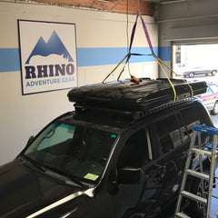 James Baroud Grand Raid roof top tent and Rhino Rack Pioneer Platform installed on Toyota Landcruiser 200 Series at Rhino Adventure Gear Warehouse Showroom