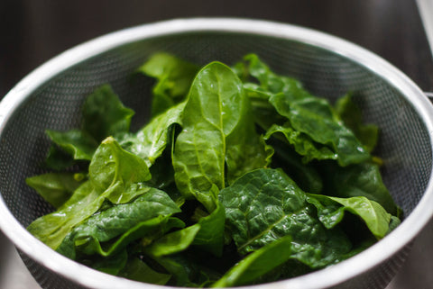 spinach in a strainer