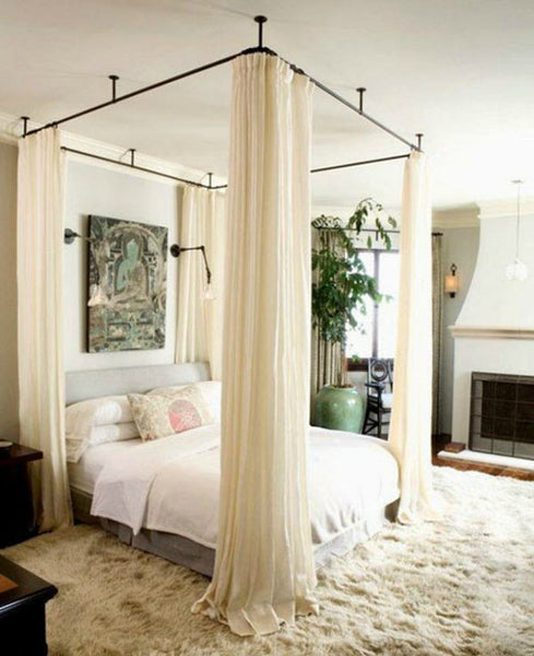 Ceiling mounted curtain rods for beds