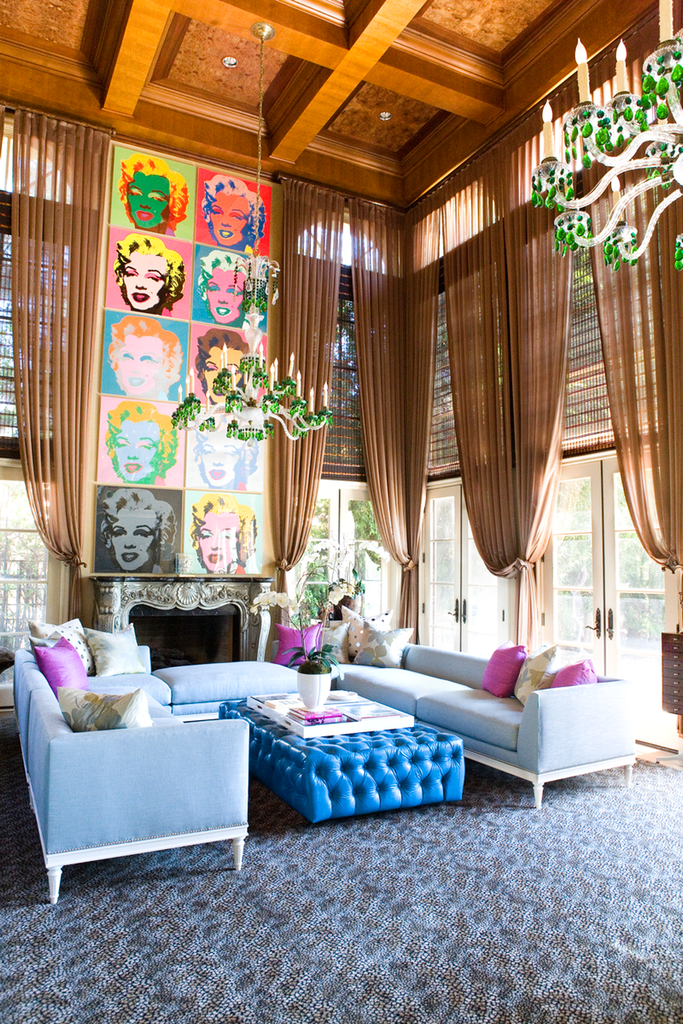 eclectic living room with green chandelier and opulent curtain finishes
