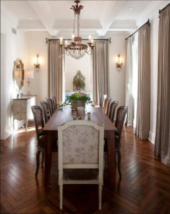 elegant dining room with wood floor formal seating and wrought iron finishes