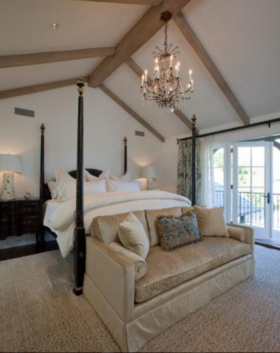 traditional bedroom with black curtain rod and floral curtains