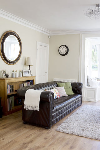 chesterfield sofa on a wooden floor