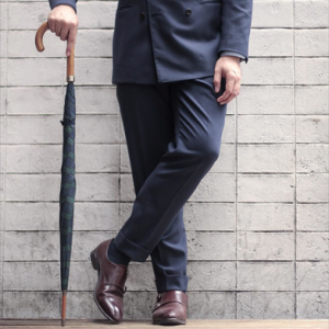 man in suit with umbrella