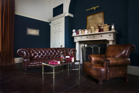 room showing two elegant chesterfield sofas
