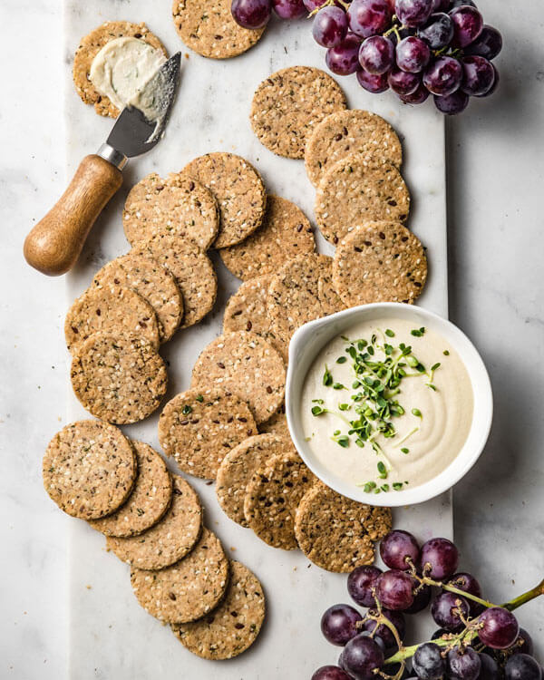 a bowl of vegan Cashew Cream Cheese and some crackers