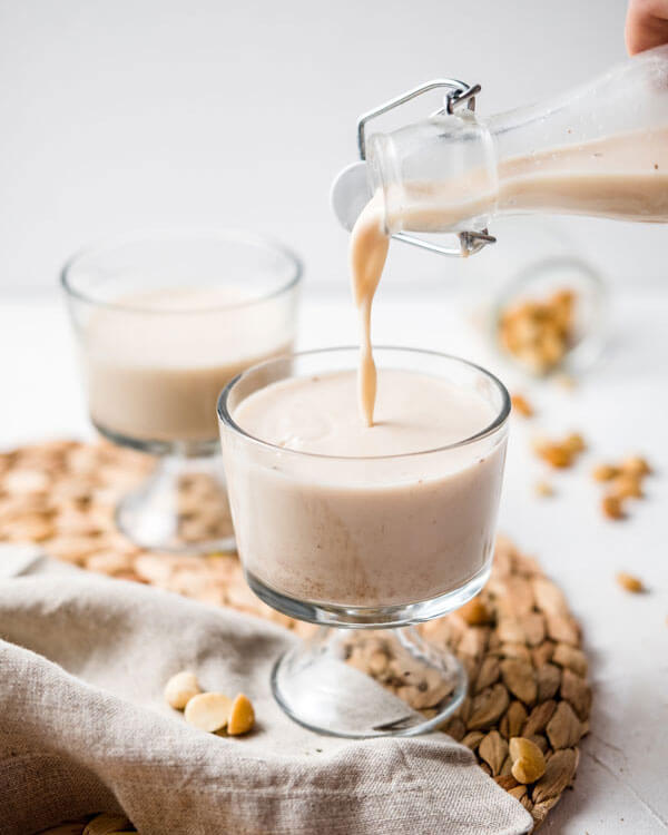 homemade Macaflower Milk being poured into a glass