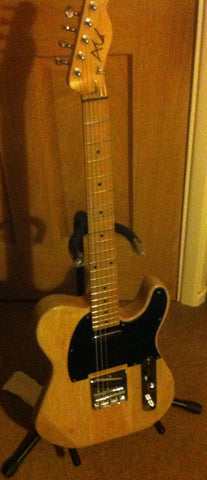 Maple neck through with ash wings... my baby