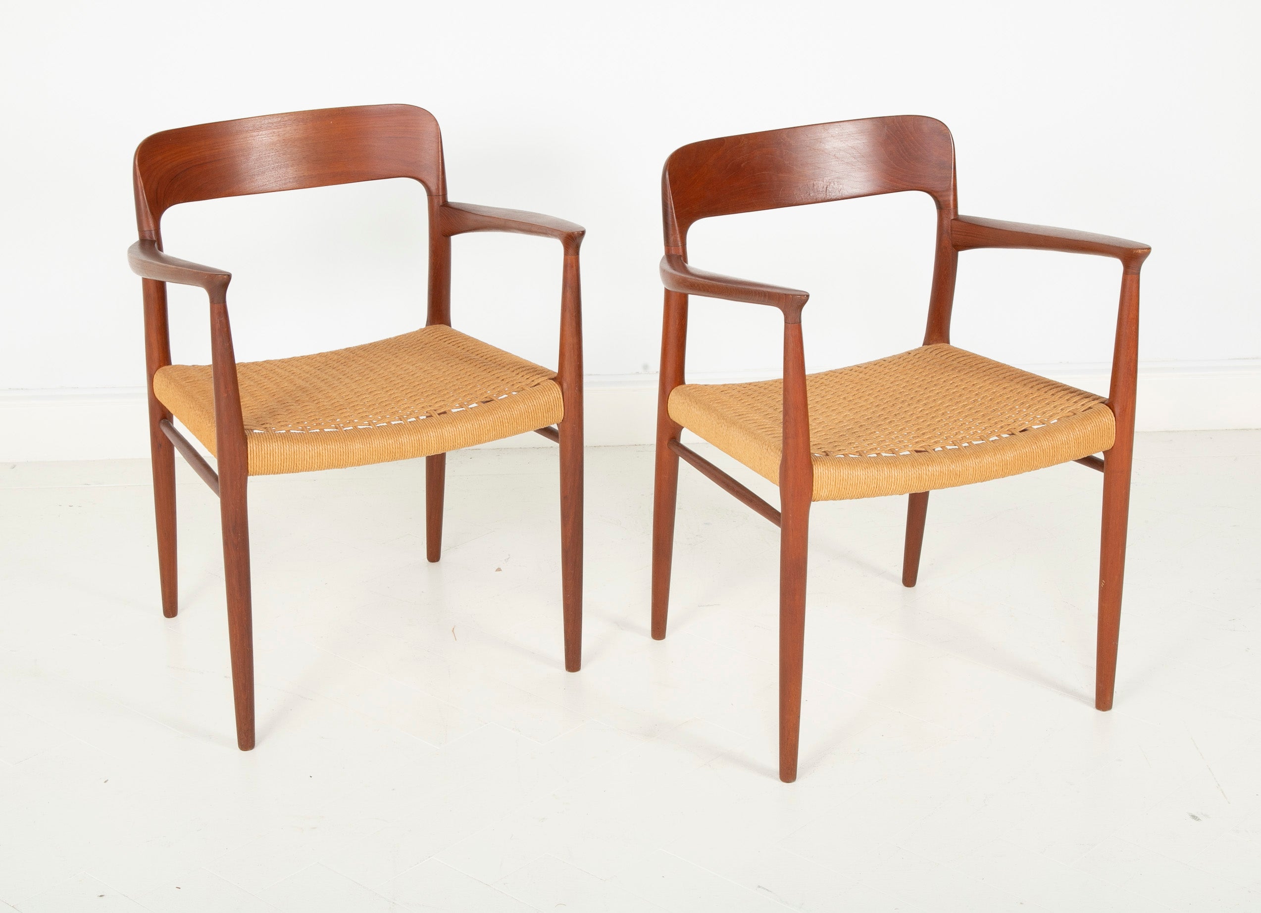 A Set Of Eight Danish Cord Seat Dining Chairs