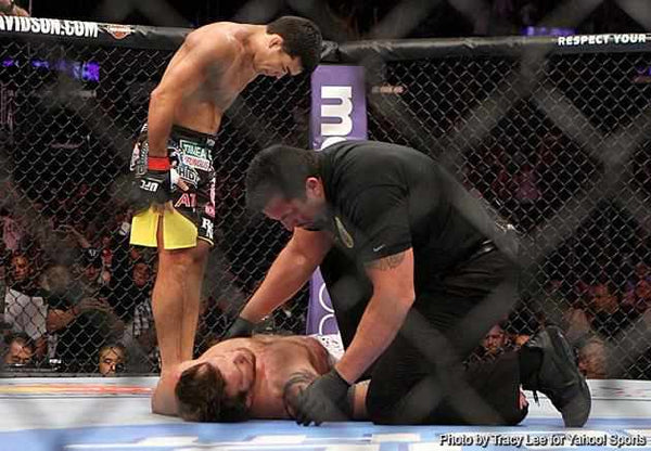 Lyoto Machida showing a sign of respect to his opponent Ryan Bader, after delivering a brutal and impressive knock out.