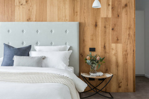 Grey bedhead with wooden feature wall