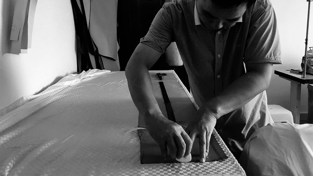 Full view of a Clairevoire tailor marking fabric for piano cover making