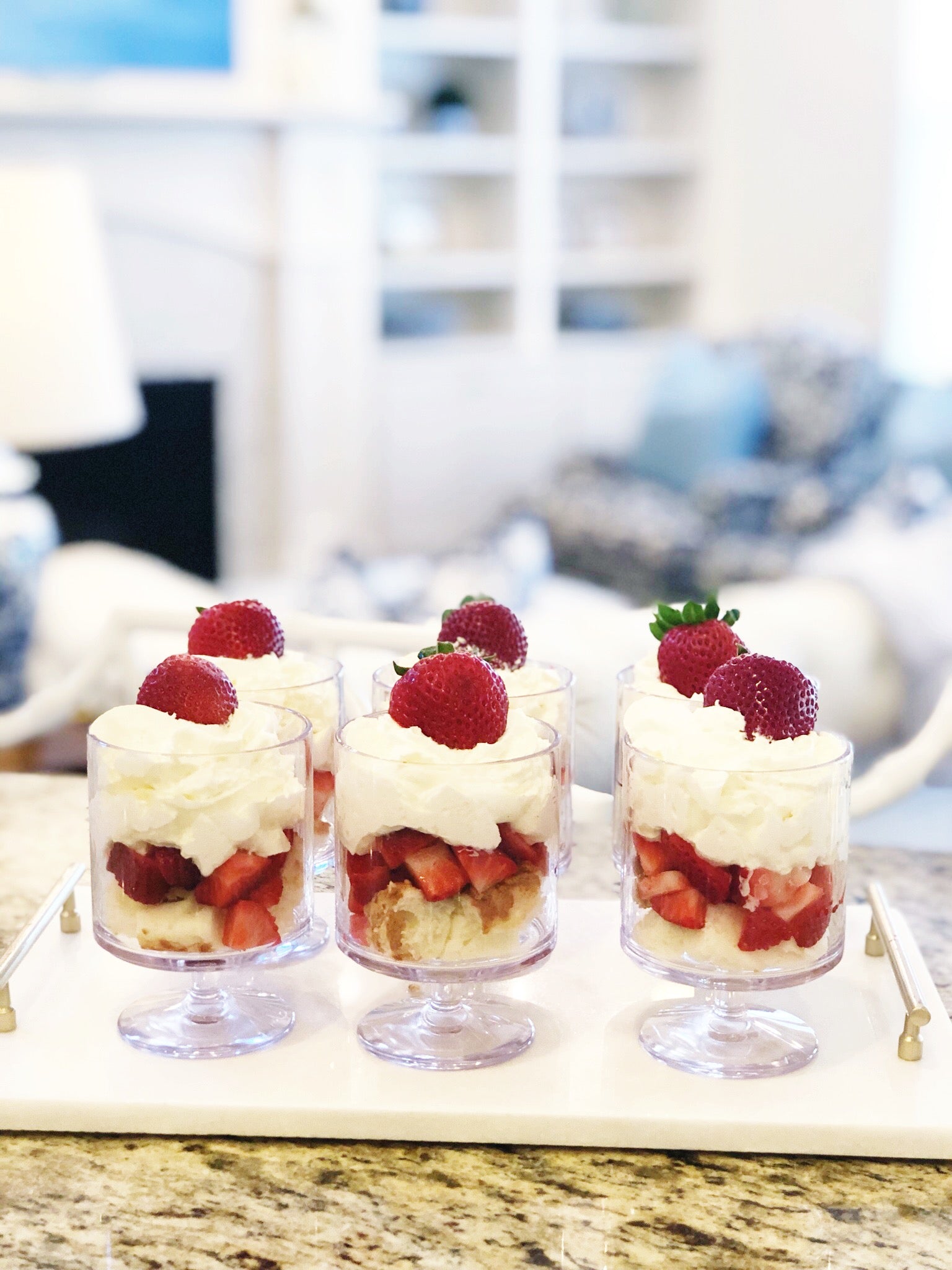 strawberry shortcake parfait in blue and white living room 