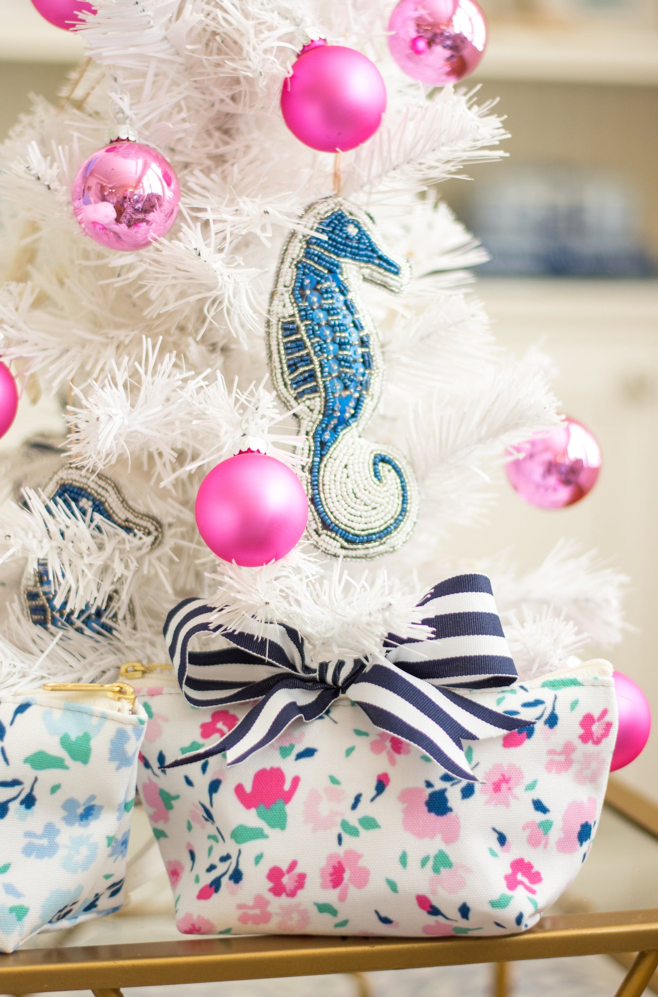 preppy white Christmas tree with pink and blue ornaments and navy striped bow