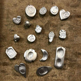 Fingerprint necklaces cast from molten argentium silver