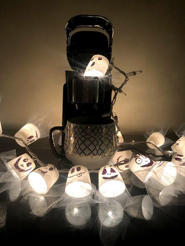 DIY string ghost lights for halloween with recycled k-cup compatible coffee pods.