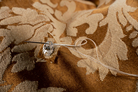 Photo detail of snap being sewn on Front A of Hong Kong Cheongsam.