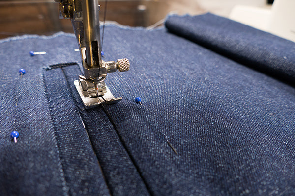 Edge stitch or stitch-in-the-ditch all the way around the inside of the welt.