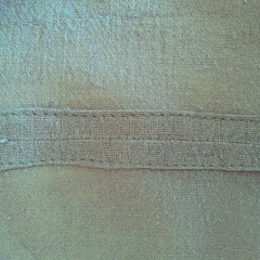 finished seam allowance pressed under and stitched to garment