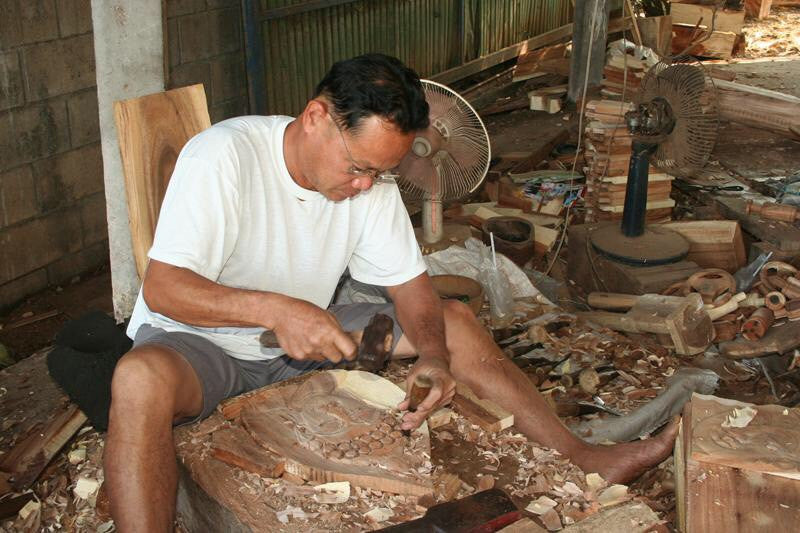 Dad carving Thai wood at home in Thailand.