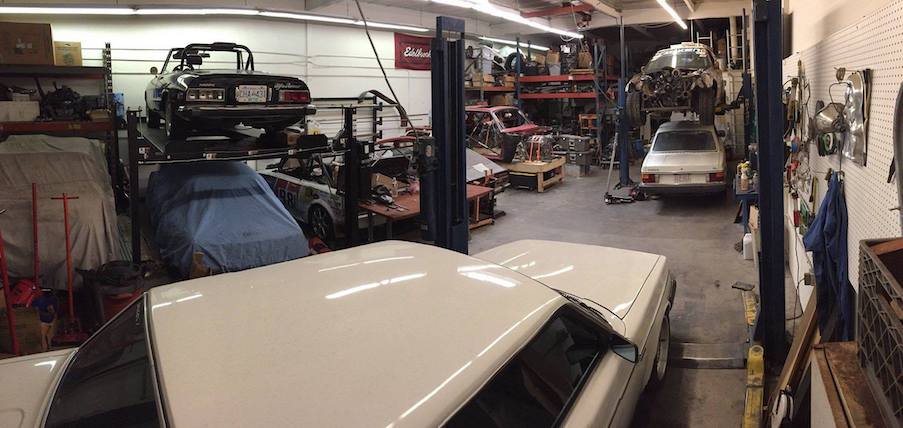 Overview of the workshop, showing cars and tools