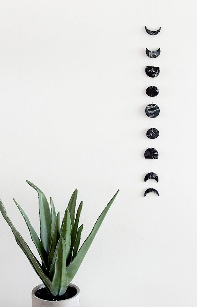  DIY Marble Moon Phase Wall Hanging from Almost Makes Perfect