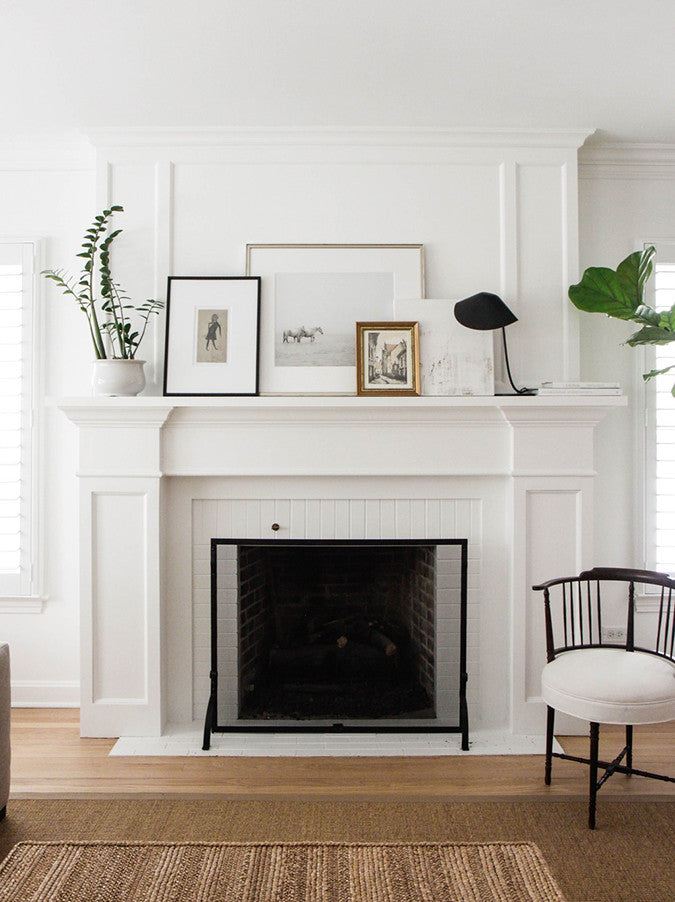 White Mantel With Framed Photos