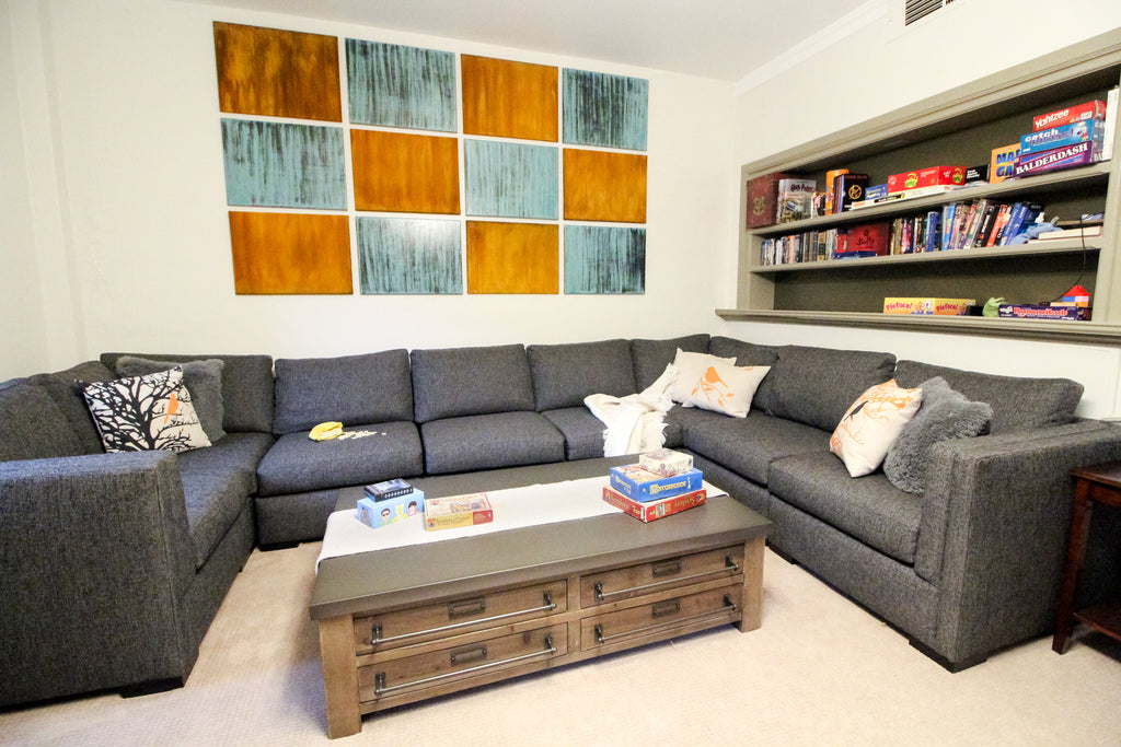 Perch Furniture helped a client fit a big sectional into a tricky basement space by breaking it up into many modular pieces. 