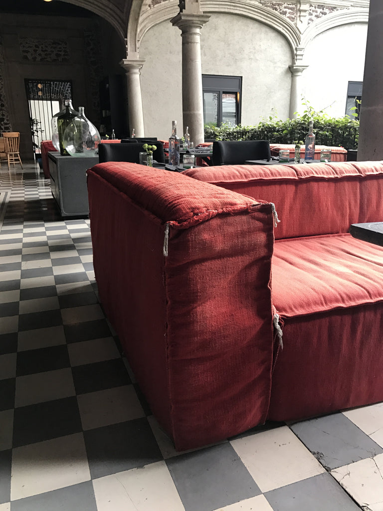 Orange velvet sofa with tight seat and tight back