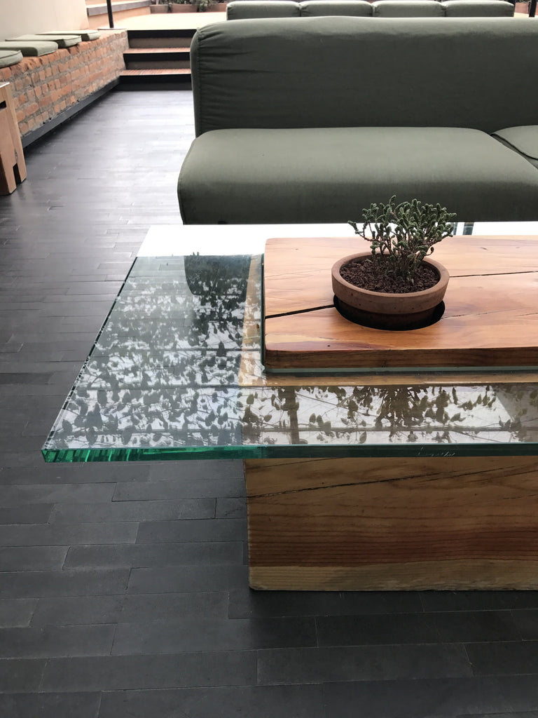 Reclaimed wood table with succulents and glass top