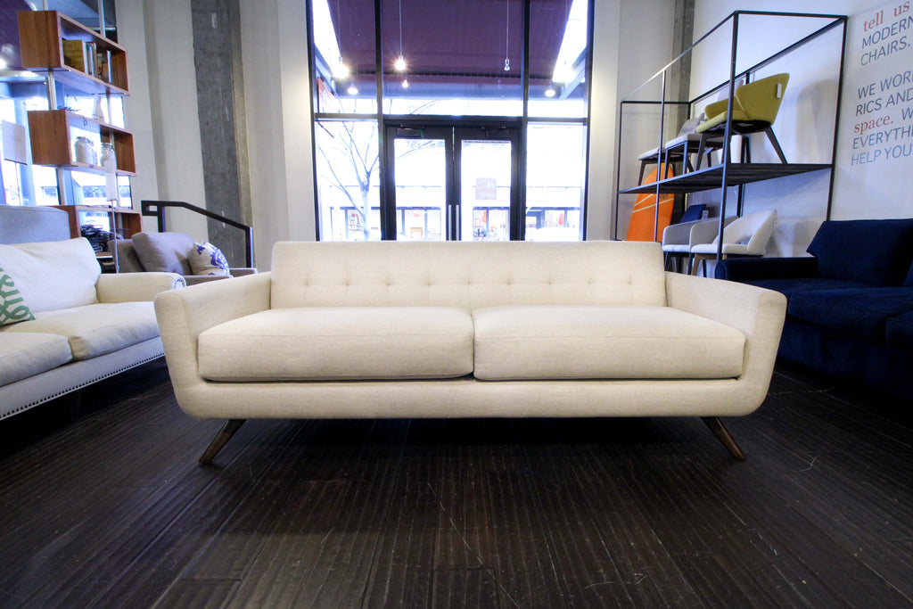 The cooper sofa features mid century style with a modern construction