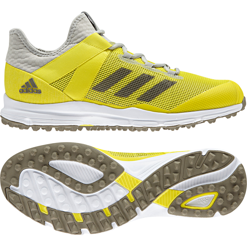 yellow adidas hockey shoes