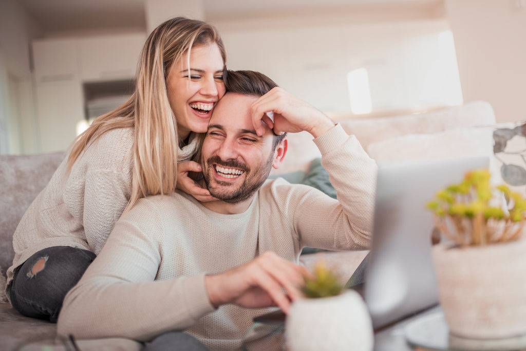 couple talking and laughing happily 