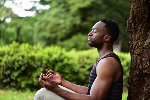 meditating young african american man who is practicing the happier mind hack