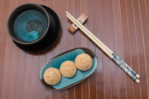 chopsticks and turquoise teacup