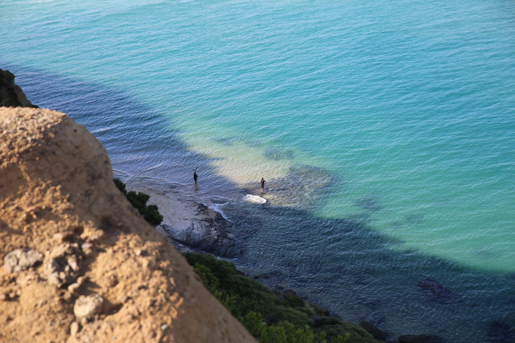 Hokianga fishing by rocks