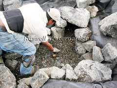 How to build a water garden pond - spread pea gravel on the horizontal surfaces instead of river rock.