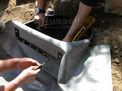 How to build a water garden pond - install the stainless steel screws to lock the liner gasket flange to the Hydro Vortex filter.