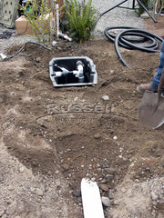 How to build a water garden pond - backfill the skimmer's remote installation pipe.