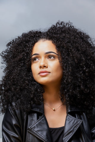 "Miss Volume" with her beautiful head of voluminous curls. (Image courtesy of Pexels)