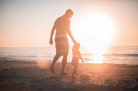 father and son at the beach