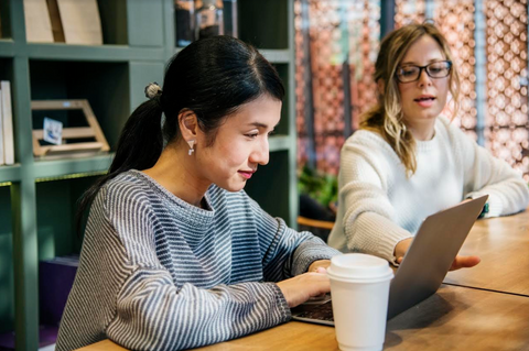 ladies at a desk