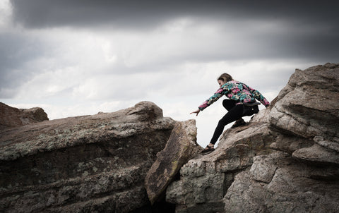 Climbing over rocks