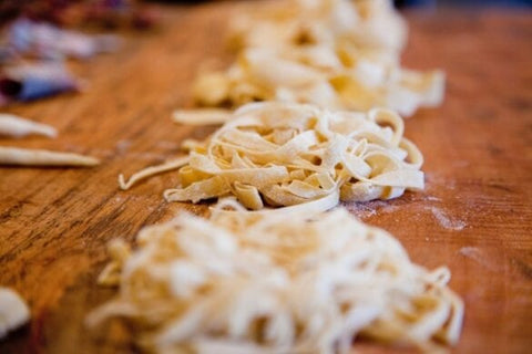 Uncooked fresh pasta on a worktop