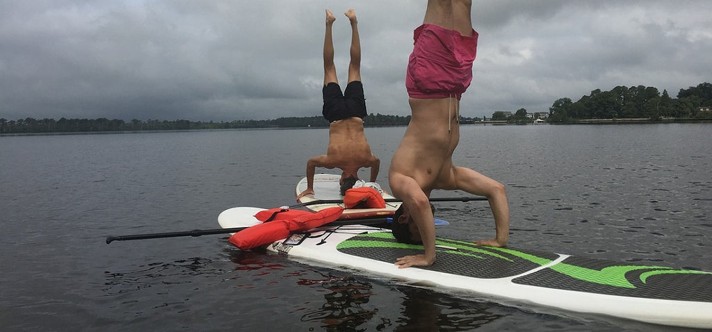 paddleboard yoga handstand
